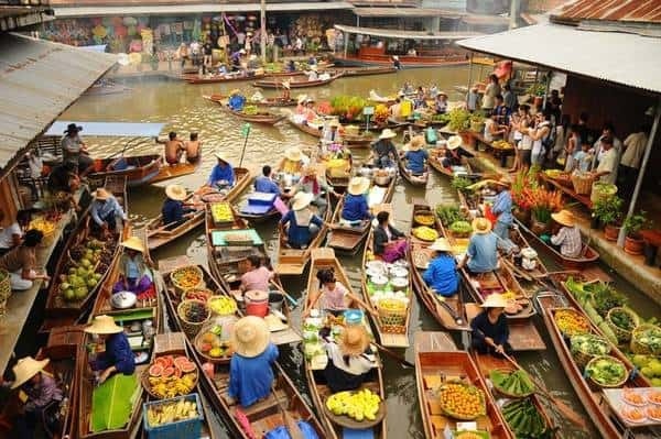 The floating market is bustling and crowded